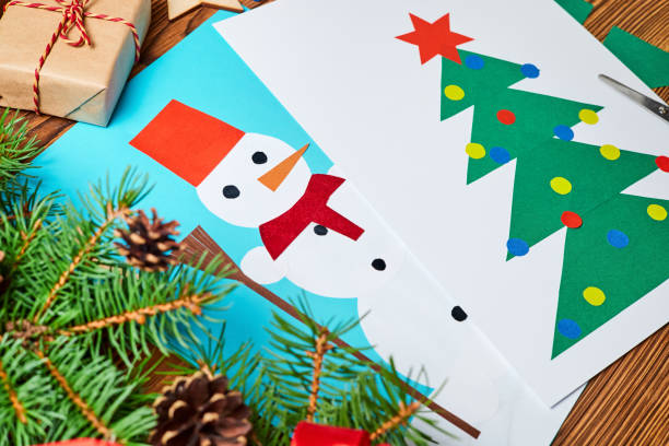 istock A Christmas greeting cards from colored paper made by a child 1352474700