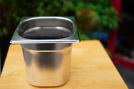 Coffee powder rubbish bin from Stainless steel on table
