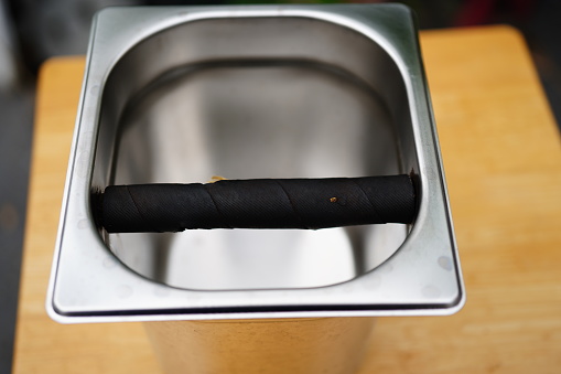 Cigarette in an ashtray on a white background