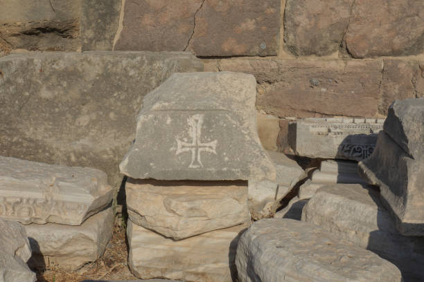istock roman cross carved on stone. Christianity. 1352475421
