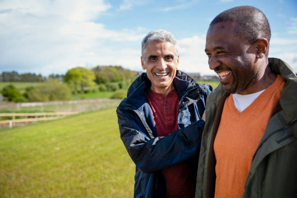 istock Senior Males Catching up on a Walk 1352476349