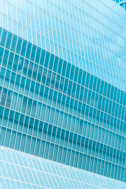 istock underside panoramic and perspective view to steel blue glass high rise building skyscrapers, business concept of successful industrial architecture 1352476834