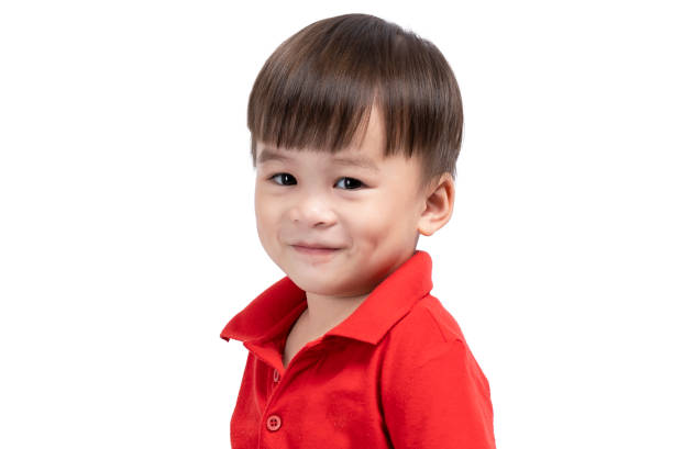 istock happy smiling little boy on white background, happy face, eyes 1352476840