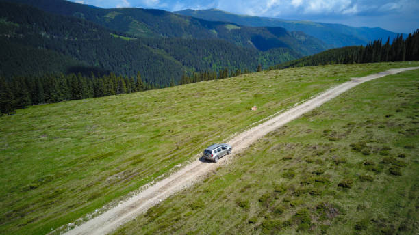 istock Off road car on a mountain crest 1352478016