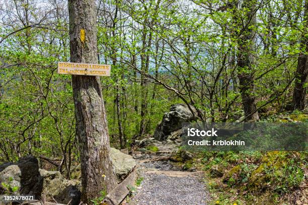 Sunny Weather At Wintergreen Ski Resort Village Town With Steps Stairs On Nature Highlands Leisure Hiking Trail In Forest Of Virginia In Spring With Sign For Hike Access Stock Photo - Download Image Now
