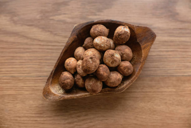 istock Bambara groundnut or Vigna subterranea which still covered with soil.Vigna subterranea ripens its pods underground, much like the peanut. They can be eaten fresh or boiled after drying. 1352479930