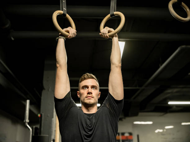 istock Man exercising in the Gym 1352480665