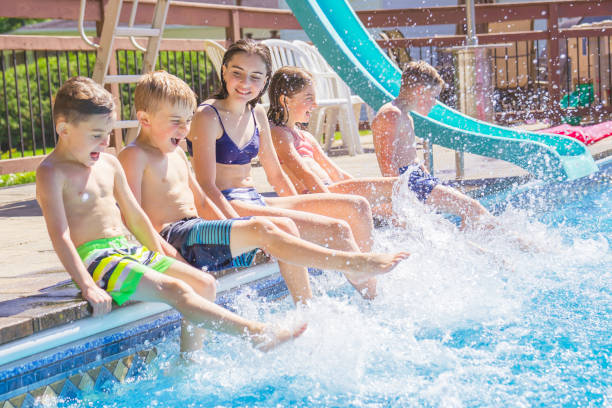 istock group of children having fun in Pool on the summer time 1352481377