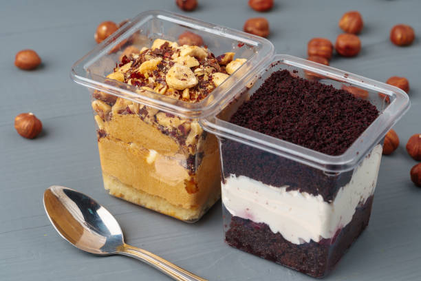 istock Creamy dessert in a plastic box on gray table 1352481651