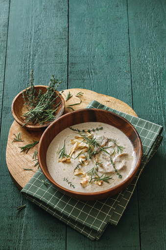 Creamy vegan wild mushroom soup with herb and vegetable chips (dairy free, gluten free).