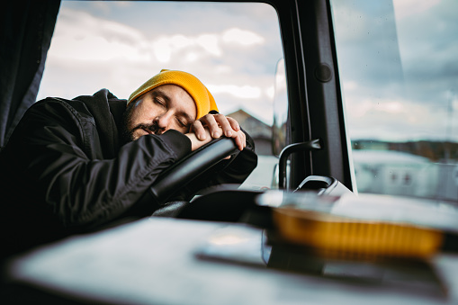 Tired and sleepy truck driver