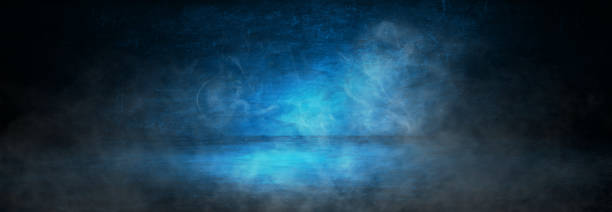 istock dark blue cement with smoke wall studio background 1352483395