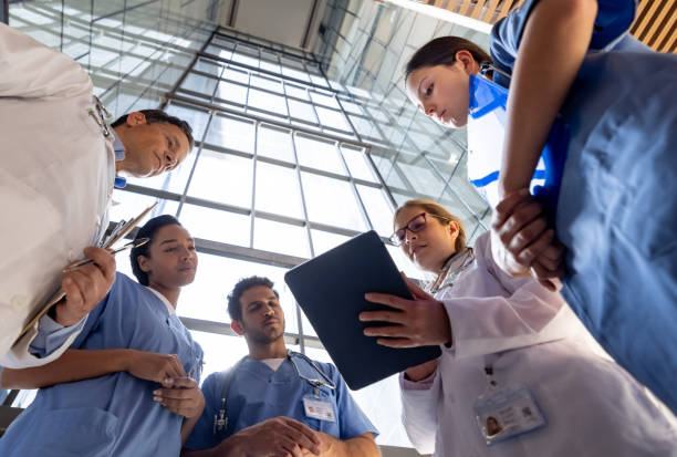 Group of healthcare workers talking in a meeting at the hospital stock photo