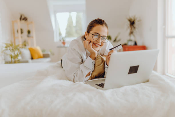 istock Happy young Woman in her Home Office and Using her Laptop 1352491396