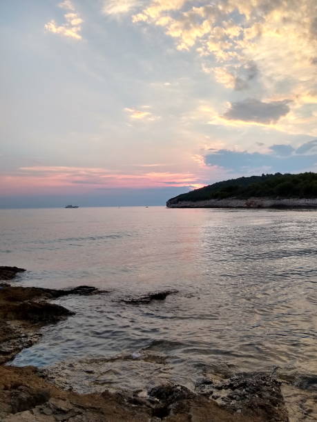 istock lonely boat with colorful evening sky 1352493539