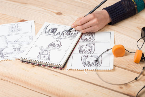 istock Artist drawing an anime comic book in a studio. 1352493747