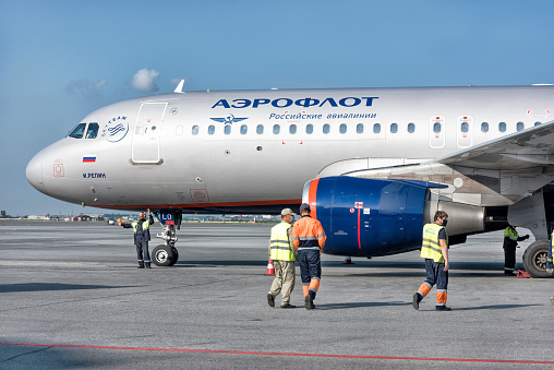 A big silver blue Aeroflot jet ready to take off at the airport: Abakan, Russia - August 08, 2020