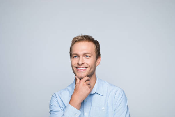 istock Headshot of friendly young businessman 1352494057