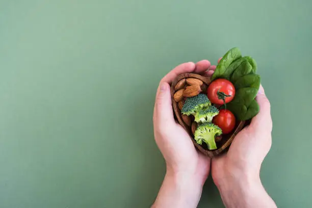 Photo of Healthy food for heart on green background.