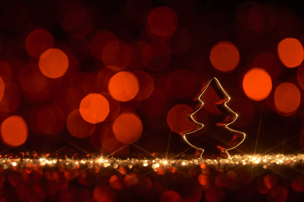 istock Christmas tree on red - Background Star Defocused Gold Bokeh 1352495343