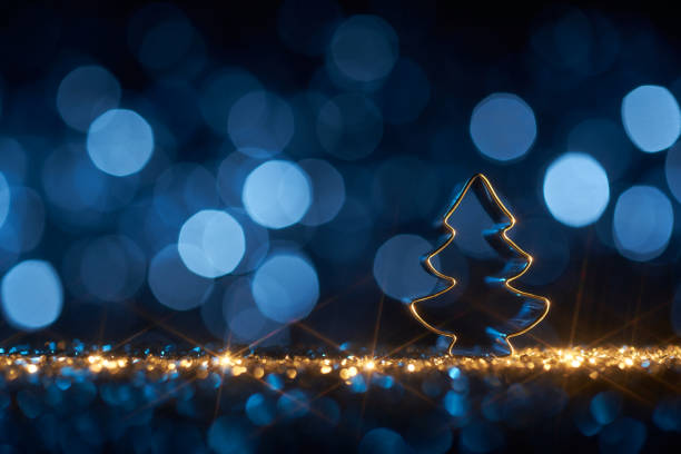 istock Christmas tree on blue - Background Star Defocused Gold Bokeh 1352495480