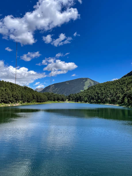 istock Engolasters lake in the Pyrenees, Andorra, sunny day, space for text, vertical photo 1352498065