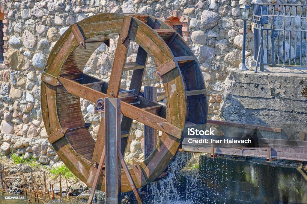 The water flow driving the water mill wheel The water flow driving the water mill wheel. Water Wheel Stock Photo