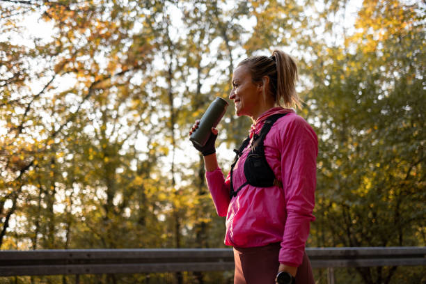 istock Woman drinking water during training activities 1352499448
