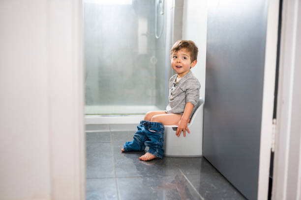istock two year old boy on chamber pot, successfull hygiene 1352499598