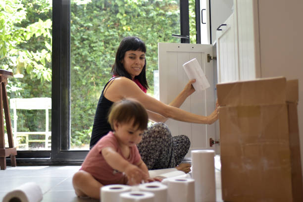 istock woman keeping merchandise on the shelf 1352499662
