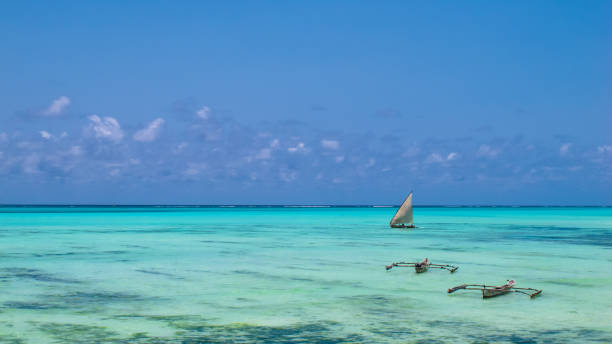 Kizimkazi, Zanzibar, Tanzania - September 29, 2024: Tourists are reaching Kwale Island in Kizimkazi, Zanzibar, Tanzania, by boat to practice snorkeling and admire the coral reefs and marine life