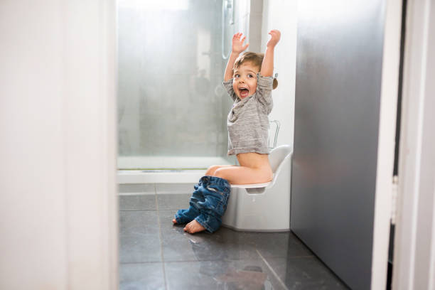 istock two year old boy on chamber pot, successfull hygiene 1352499765
