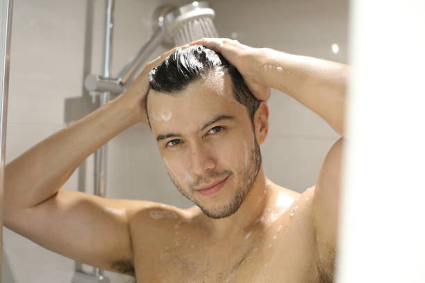 istock Young man in the shower 1352500469