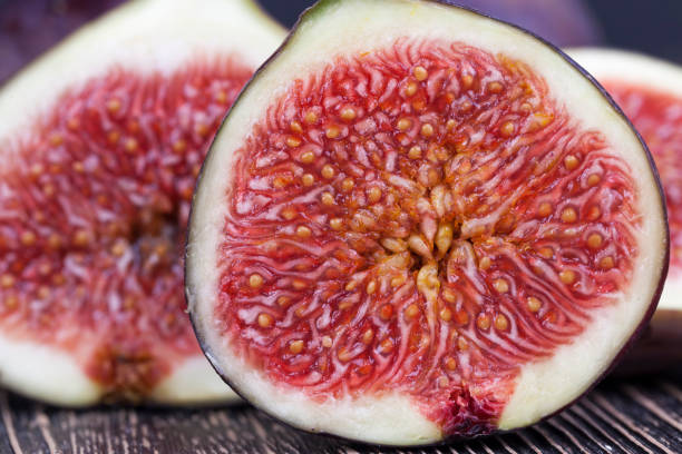istock ripe purple figs on a wooden table 1352502956