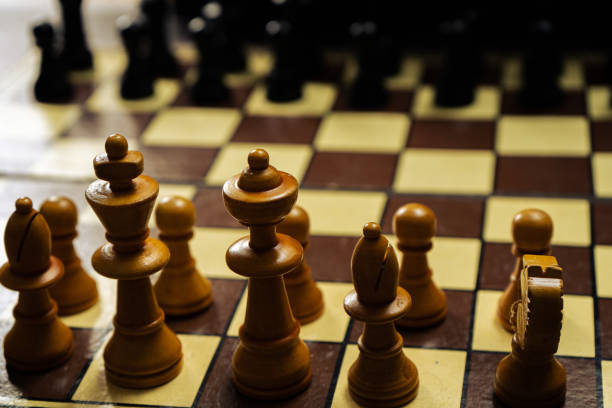 istock Chess pieces on an assembled board before starting the game. 1352503667
