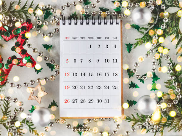 istock Calendar and green branches of a Christmas tree 1352505327