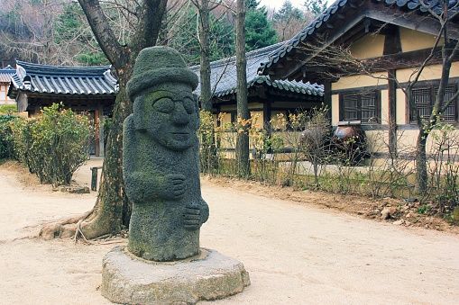 Ancient stone Grandfather figure (Hareubang) is fertility symbol in korean culture. Carved Basalt Harubang idols are big phallic statues from Jeju island which protect from evil ghosts and bring good luck. Seoul, South Korea,March 2013