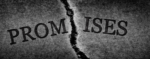 istock Broken Promises and breached agreement dishonesty represented or symbolized by cracked cement 1352506067