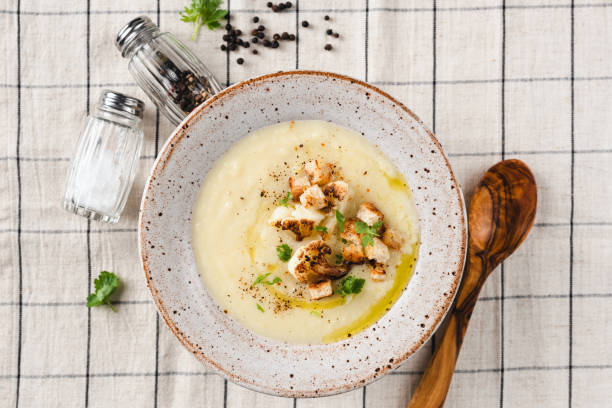 istock Cauliflower cream soup with croutons 1352507103