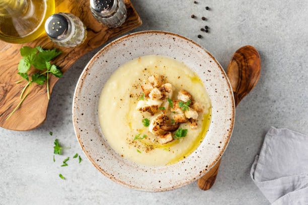 Cauliflower cream soup or soup puree Cauliflower cream soup or soup puree. Healthy vegan bowl of warm soup cream soup stock pictures, royalty-free photos & images