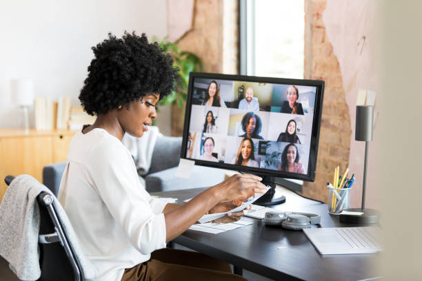 istock Businesswoman taking notes during virtual meeting 1352511887