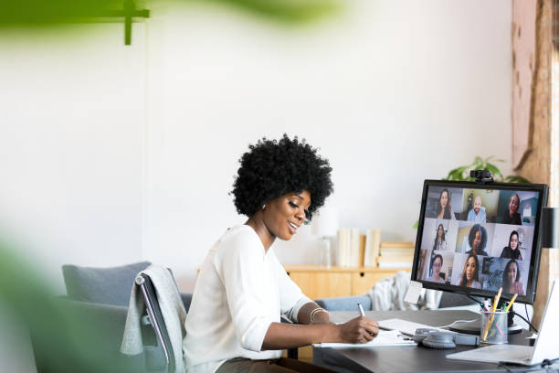 istock During virtual meeting, a businesswoman takes notes 1352511896