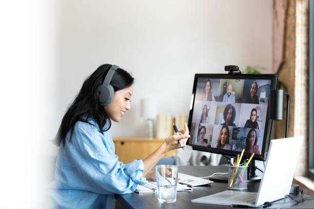 istock Businesswoman reviews document during video call 1352511971