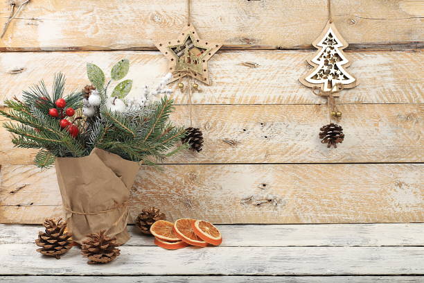 istock Empty rustic table with live Christmas tree in eco bag and wooden decorations.Christmas and New Year mockup for design and product demonstration 1352512023