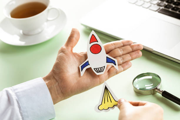 istock Business Person with Startup Rocket 1352512026