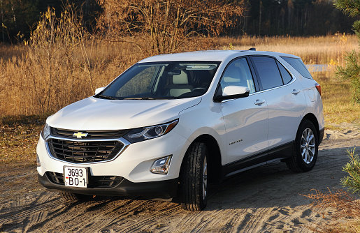 Belarus, Minsk -31.10.2021:2017 Chevrolet Equinox SUV in white. Chevy, a division of General Motors, also makes Suburban, Cruze and Traverse.