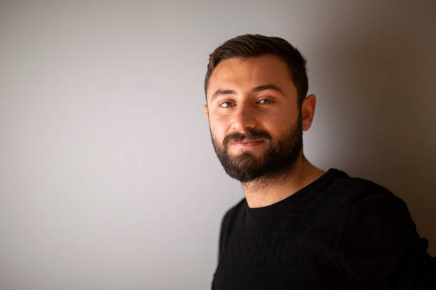 istock Portrait of smiling handsome man 1352515359