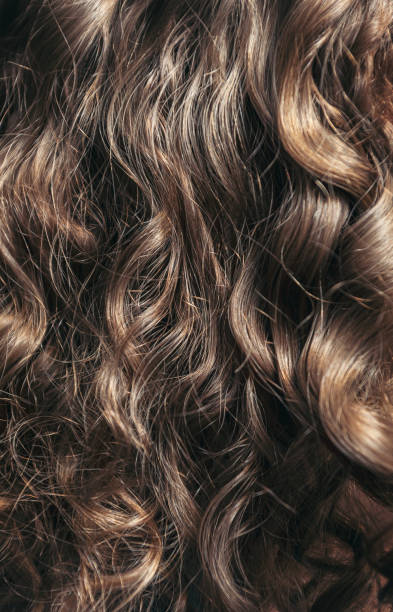 istock Naturally Curly Brown Hair 1352515661