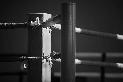 The image has a shallow depth of field with focus at the point where the ropes are attached to the rack.