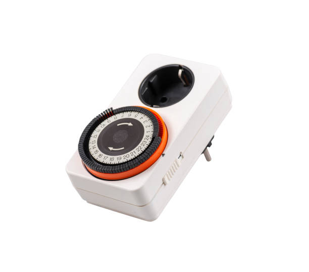 istock Timer switches mechanical for indors isolated on white background. Mechanical timer for electricity. Home security supply. Smart home tools. 1352518205